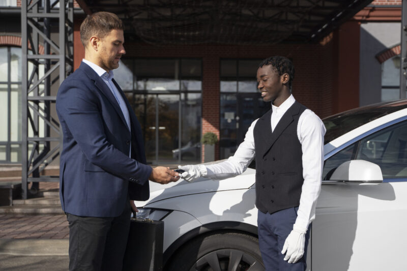 side-view-man-valet-shaking-hands-scaled-e1728855970611